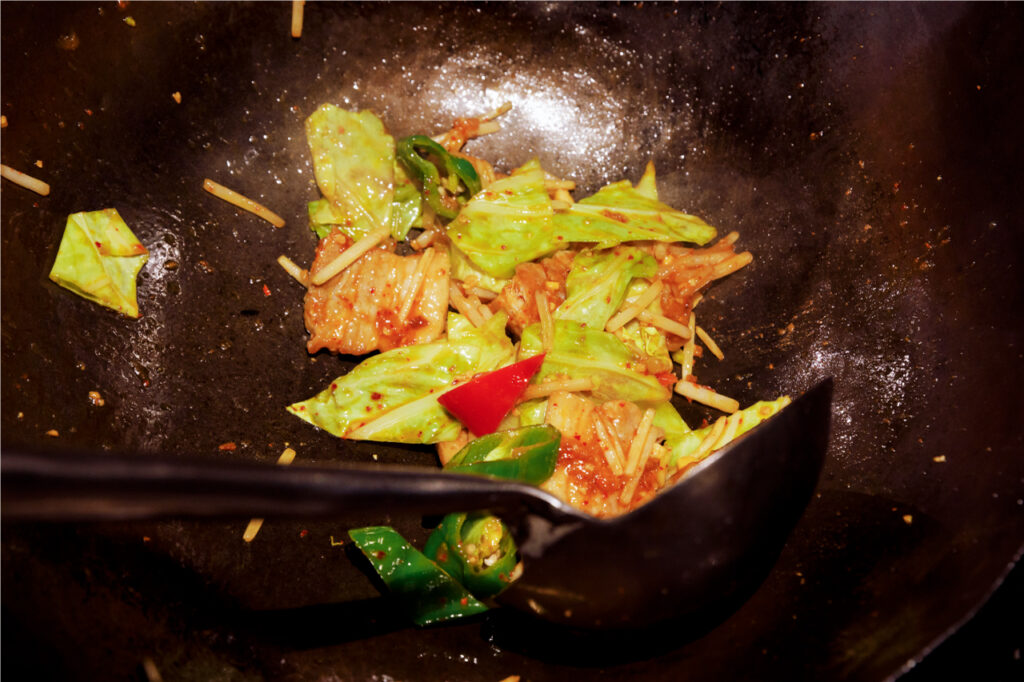 Step 3 of stir frying vegetables using weywey