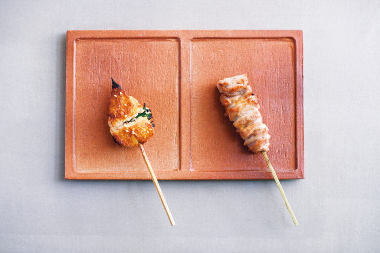 Boneless yakitori chicken wings with green onions and Omi gamecock thighs