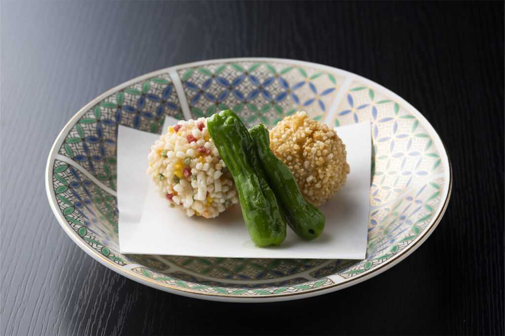 Deep-fried shrimp paste mixed with coarsely minced duck and sprinkled with five-colored arare and brown rice flour at Yamabana Heihachi Chaya