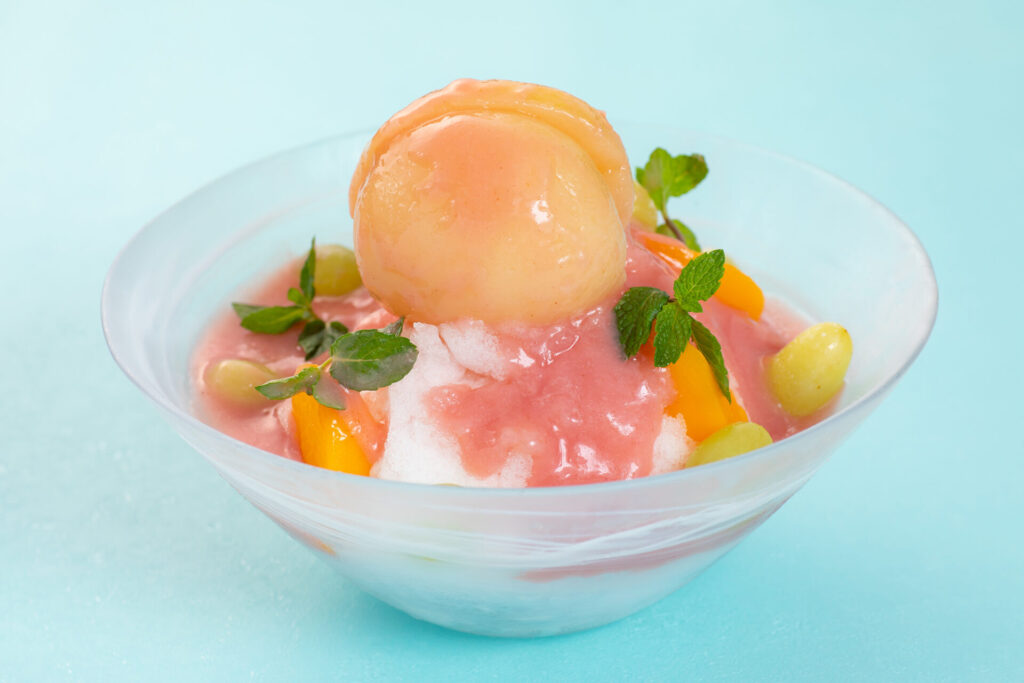 Shaved ice with whole peaches and muscat
